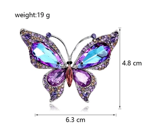 Detailed view of luxury butterfly brooch with purple crystals and size dimensions