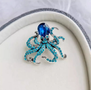 Octopus animal brooch in silver-plated alloy with blue rhinestones and teardrop gemstone