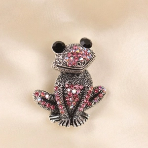 Sparkling pink crystal frog brooch pin with vintage silver finish and black gem eyes