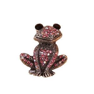 Vintage frog brooch with pink crystals and silver metal finish on white background