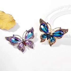 Elegant butterfly brooches with aurora purple crystals and sparkling rhinestones on gold base