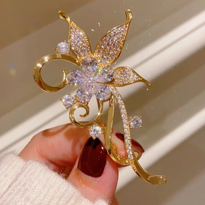 Elegant gold butterfly brooch with shimmering white zircons for luxury blazer accessories