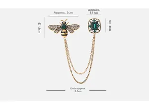 Detail showing dimensions of vintage bee brooch with green gems and double chains