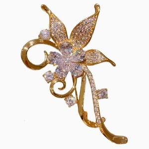 Vintage floral brooch with sparkling rhinestones and golden petals for suit jackets