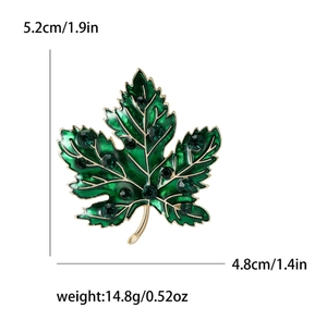 Detailed size specifications for the vintage green maple leaf enamel brooch with gold accents