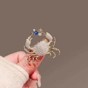 Creative crab brooch with gold alloy base and sparkling white zircon stones for women