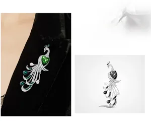 Detailed view of luxury peacock brooch with emerald zircons on a black velvet blazer