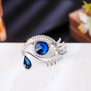 Exquisite silver devil eye brooch with blue crystal and sparkling cubic zirconia stones