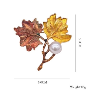 Vintage enamel maple leaf brooch with white pearl, dimensions 5.5cm by 5.0cm