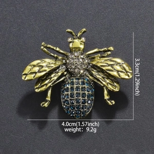 Vintage alloy bee brooch with blue rhinestones and gold wings for fashion accessories