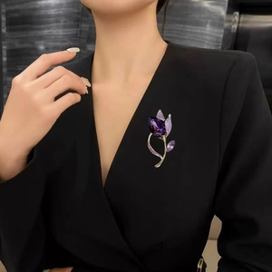 Elegant purple tulip crystal brooch pin on black blazer for classic styling