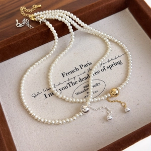 Elegant French style double pearl necklace with textured gold and silver metal beads