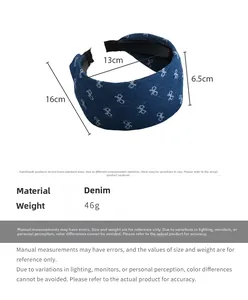 Detail showing denim fabric texture and dimensions of the wide blue bow headband