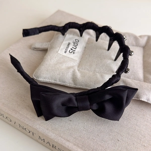Elegant black satin bow headband with teeth comb and sparkling rhinestone accents
