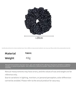 Detail of oversized ethnic paisley scrunchie with 20cm diameter and fabric texture