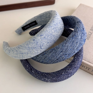 Three blue padded headbands in light to dark tweed fabric with handmade woven texture