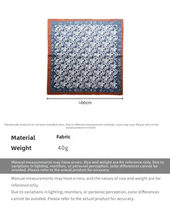 Detail view of 66cm square paisley scarf with deep blue print and rust red edges