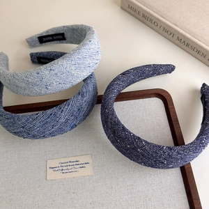 Three shades of blue padded tweed headbands in a stylish layered composition