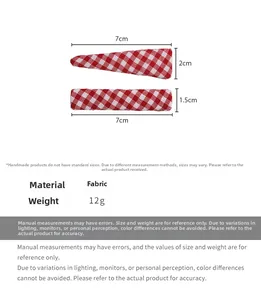 Detail of red and white checkered fabric hair clips set with dimensions 7cm shown