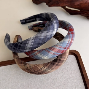 Three-piece set of handmade plaid fabric headbands in navy, light blue, and brown patterns