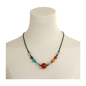 Ethnic beaded necklace with red agate, green jade, and turquoise on woven rope cord