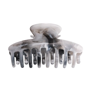 Detailed view of the gray ink marble hair claw clip with a polished finish texture