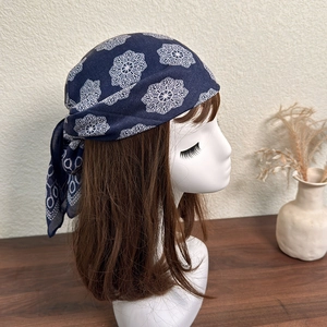 Navy blue cotton bandana with white floral embroidery shown on a mannequin head