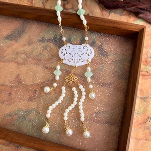 Detail of Ruyi lock pendant with double happiness character and long pearl tassels