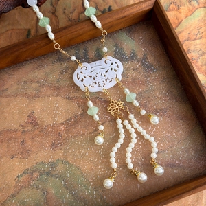 Traditional Chinese necklace with white jade ruyi lock pendant and long silk tassels