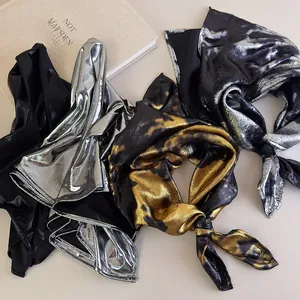 Flat lay of four vintage Y2K metallic headscarves in black and silver fabrics