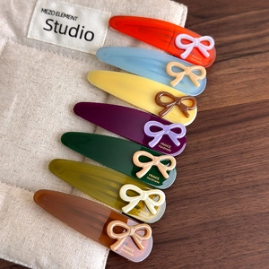 Set of 7 colorful teardrop acetic acid hair clips with cute bow details and France logo