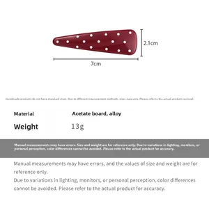 Detail view showing dimensions of 7cm x 2.1cm for this red polka dot hair clip