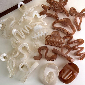 Cloud star and wavy geometric hair claws in cream white and amber brown colors