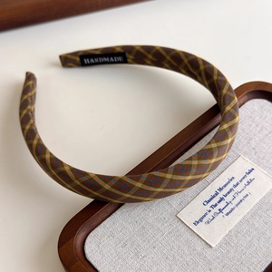 Detailed close-up of handmade vintage plaid headband featuring a premium fabric texture