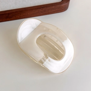 Detail of a large cream marbled acrylic hair claw clip with sturdy internal teeth