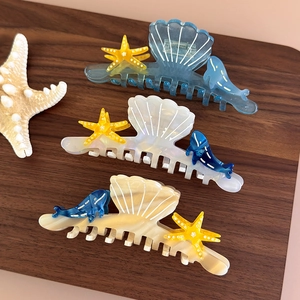 Ocean themed acetate hair claw set featuring sea shell and starfish hair clips for women