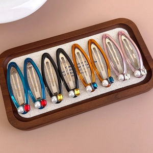 8-piece set of colorful teardrop hair clips with faux pearls and rhinestones on fabric