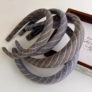 Three-piece retro striped fabric headbands in dark blue with handmade label detail