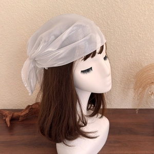 Detailed view of semi-transparent silver bandana with elegant rear tie knot styling