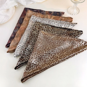 Detail showing five assorted animal print scarves with leopard and marble textures