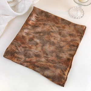 Detailed close-up of Y2K vintage silver headscarf with metallic glossy texture