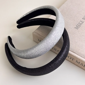 Detail of silver and black glitter sponge headbands with thick retro sparkling texture