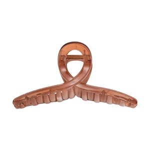 Detail of amber brown translucent hair claw clip with sturdy metal spring mechanism