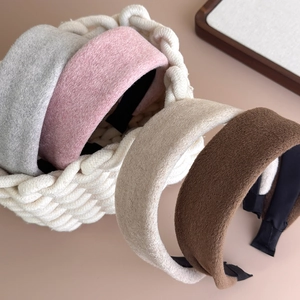 Detailed texture of thick padded wool headbands in Morandi grey, pink, beige and brown