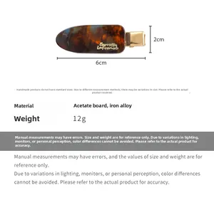 Detailed view of tortoise shell acetate hair clip with 6cm x 2cm size specifications
