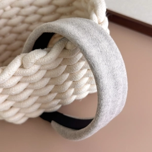 Detail of light grey wool texture headband with soft plush finish and non-slip inner lining