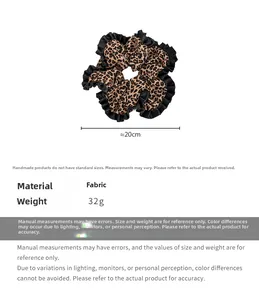 Detail of 20cm leopard print satin scrunchie with black ruffled edges on white background