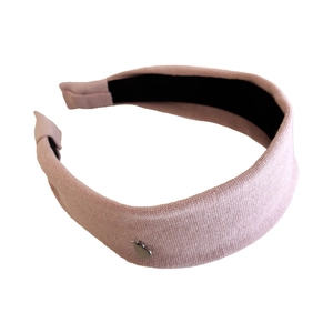 Vintage pale pink cotton padded headband with small silver heart charm on plain white background