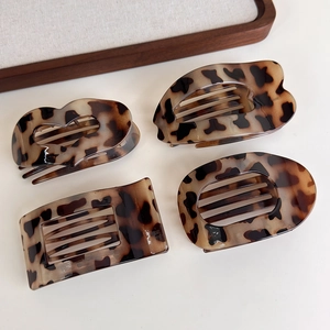 Set of four tortoiseshell claw clips in heart, oval, and rectangular geometric shapes