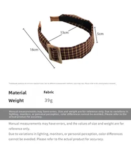 Macro shot of brown plaid fabric headband with square buckle and dimensions detail